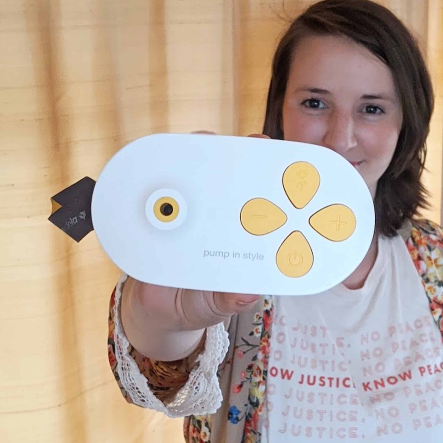 UGC_PNSMX_Mom_lifestyle Mom holding Medela Pump In Style with MaxFlow Breast Pump