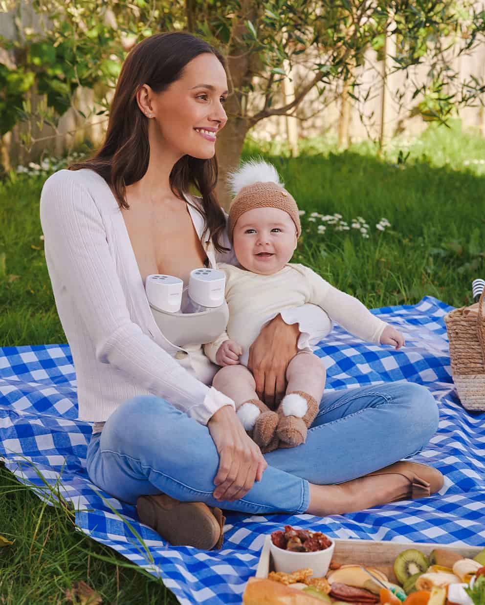 8 Women holding baby with Momcozy S12 Pro Breast Pump
