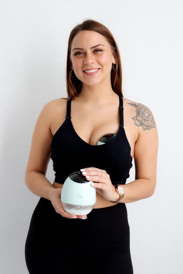 IMG_6412-2-min Women wearing and holding Zomee Fit Wearable Breast Pump